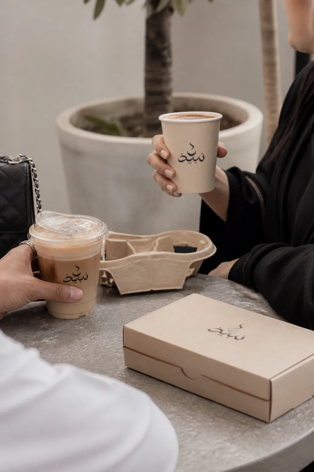 Nabidh Coffee for two lifestyle photo generated by Logofai